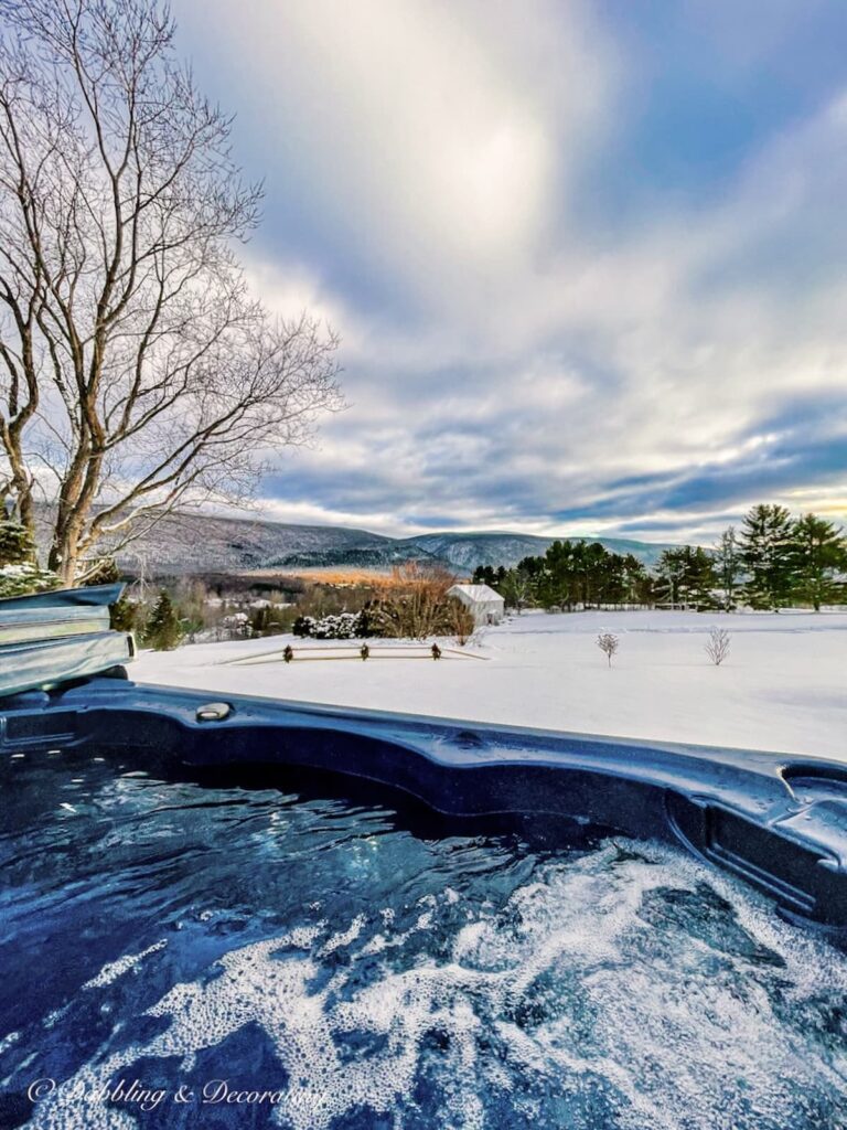 Hot tub views of Green Mountains of Vermont covered in snow from our house.