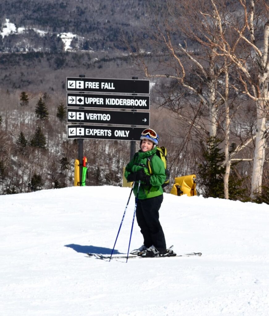 Woman posing on skis at Stratton Mountain Ski Resort in Vermont in April.