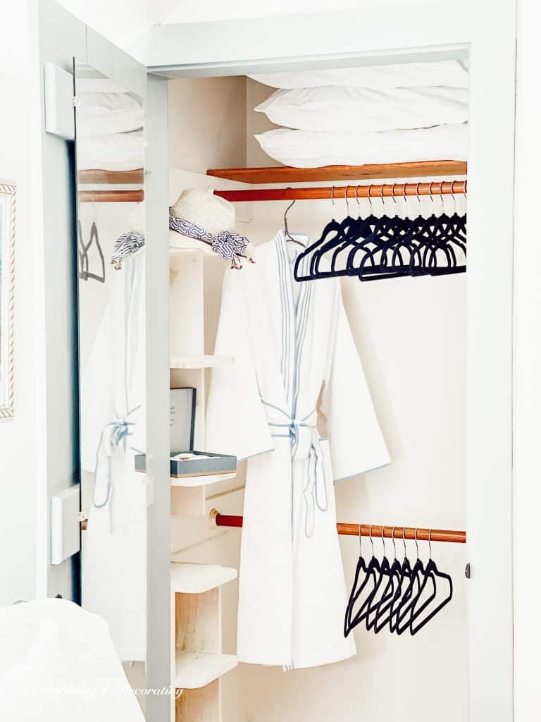 closet with bathrobe and hangers