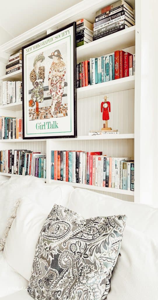 A bed with a book shelf