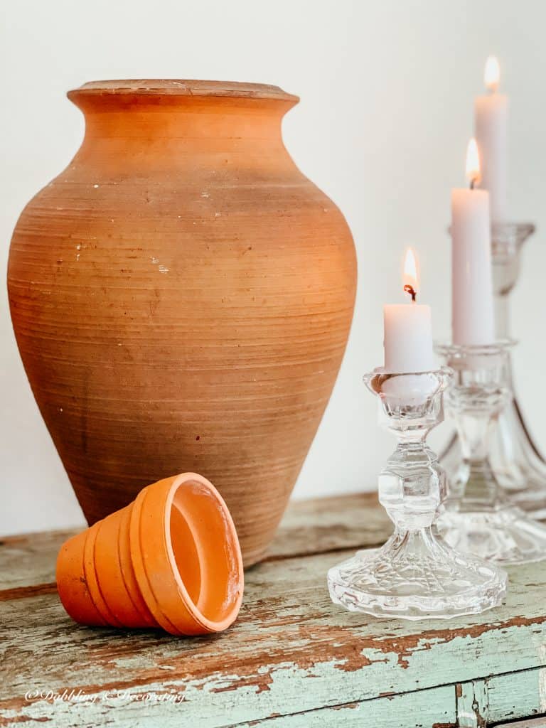 Terracotta pots and glass candlesticks.