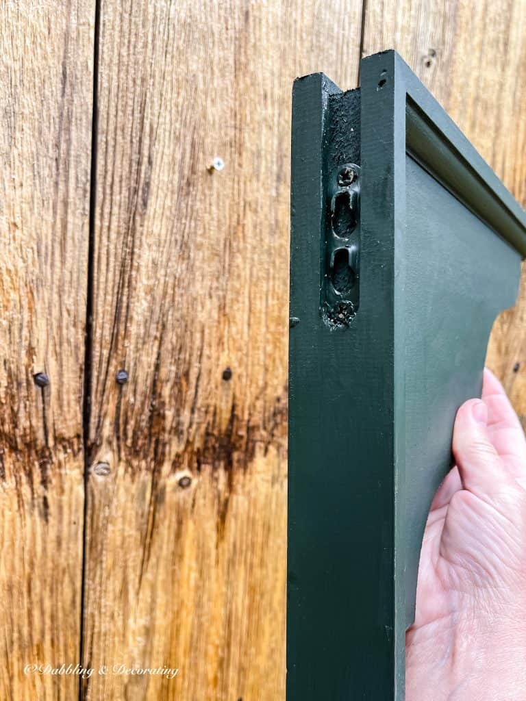 wooden shelf painted green