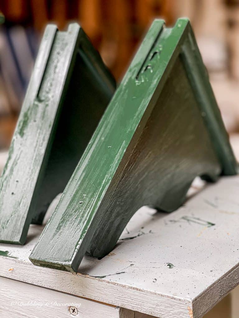 painted green wooden shelf holders