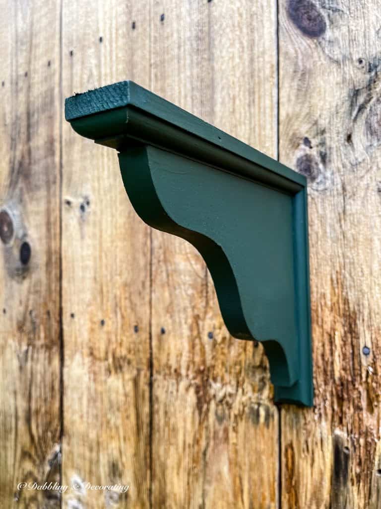 green wooden shelf holder