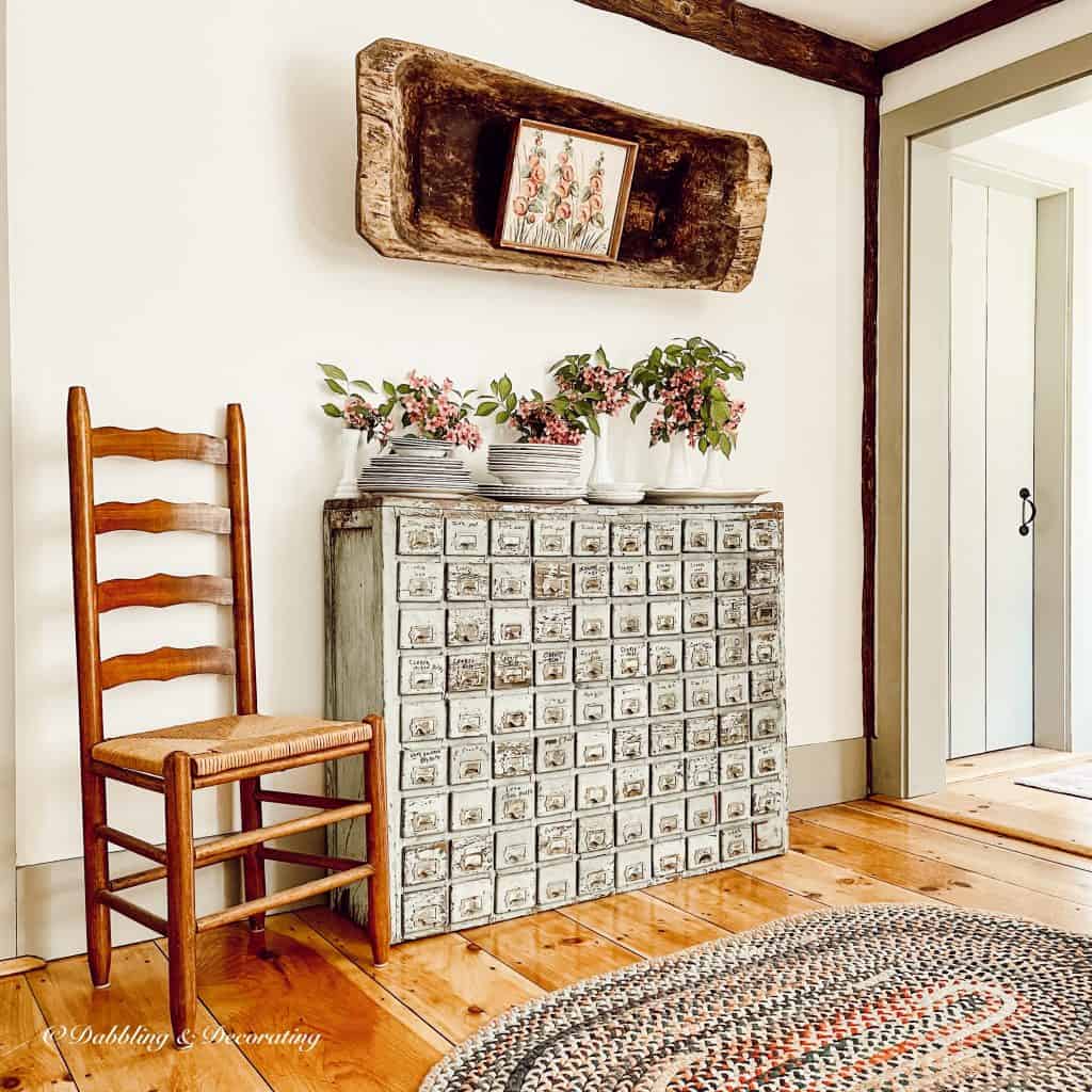 Vintage Apothecary, braided rug and yard sale dough bowl.