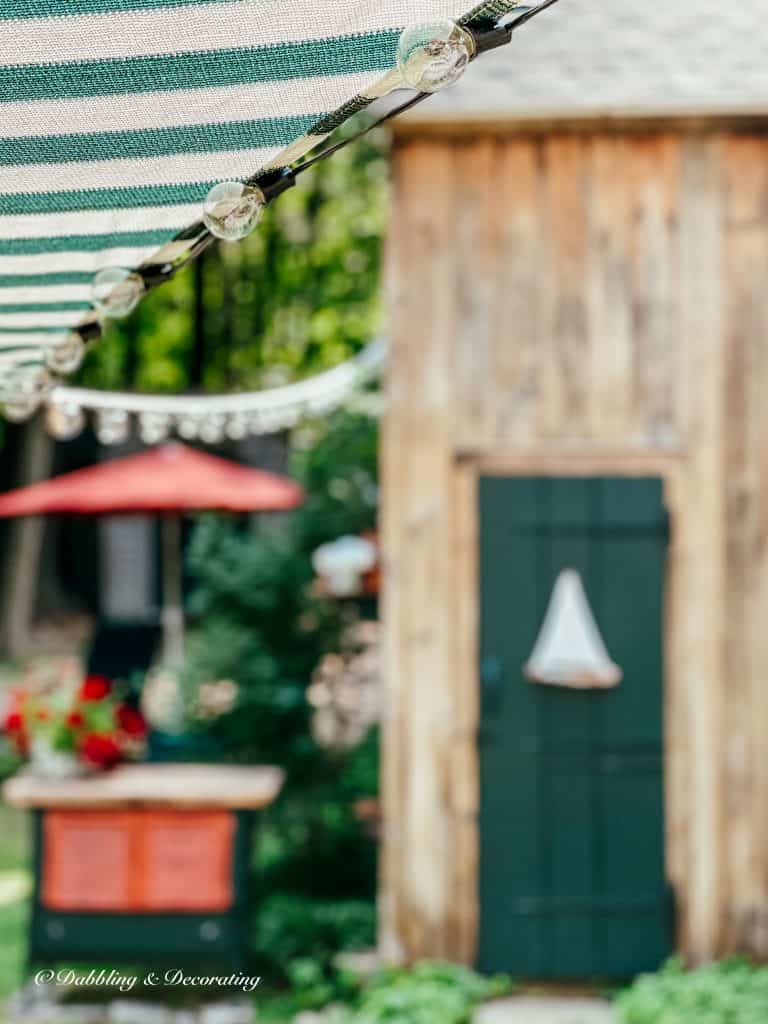 A Shady Solution:  Sun Shade Sail Awning with lights.