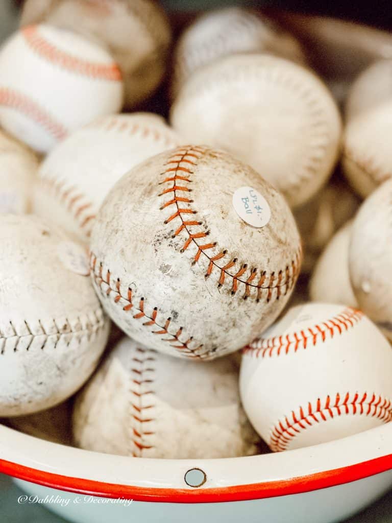 bucket of old baseballs