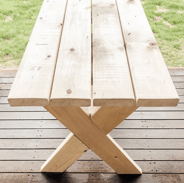 A wooden bench sitting in the grass