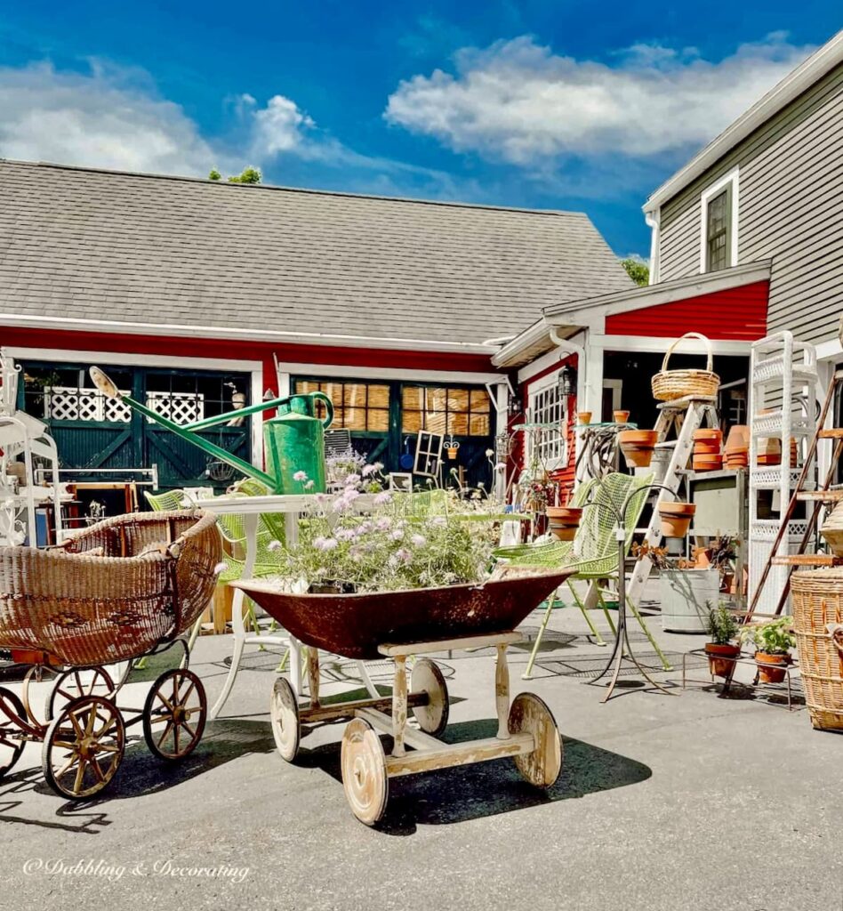 Sage Farm Antiques woods and white vintage pop up market outdoors.