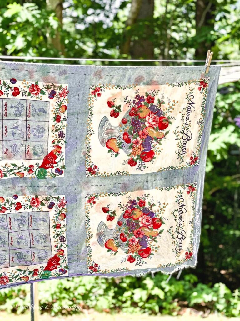Blue vintage tablecloth on clothesline.