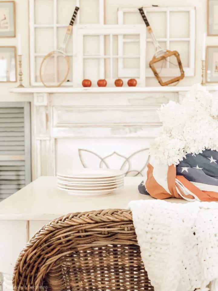 Vintage Style Patriotic Centerpiece with tennis racquets and old flag and hydrangeas.