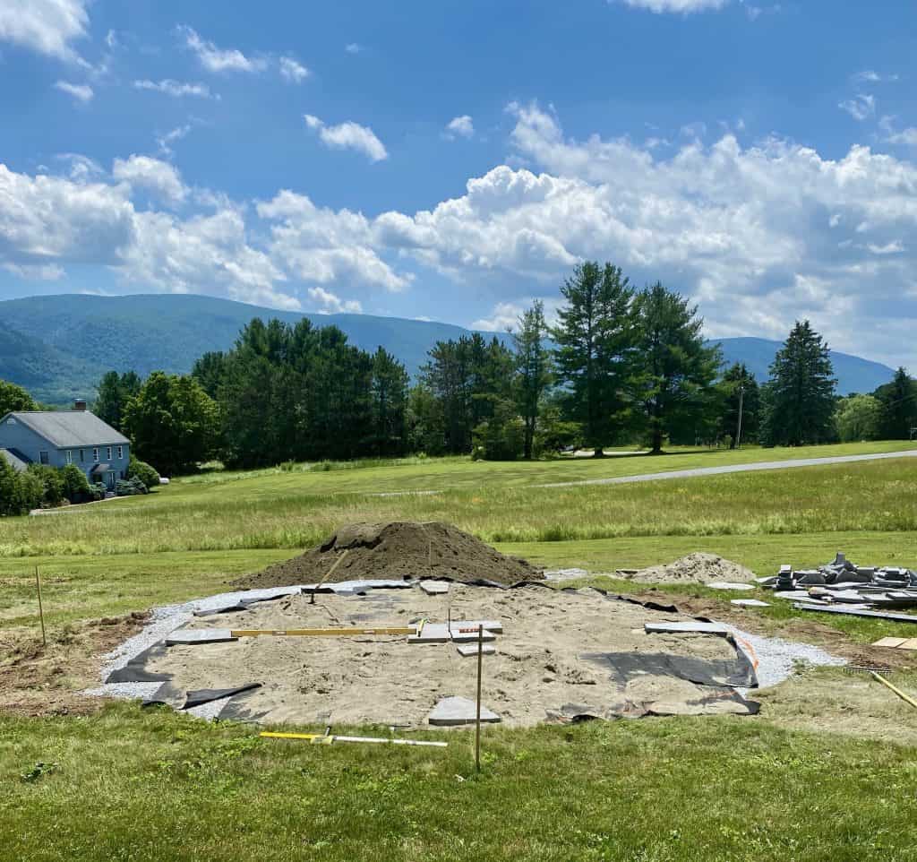 Patio hole and dirt with mountains in the background