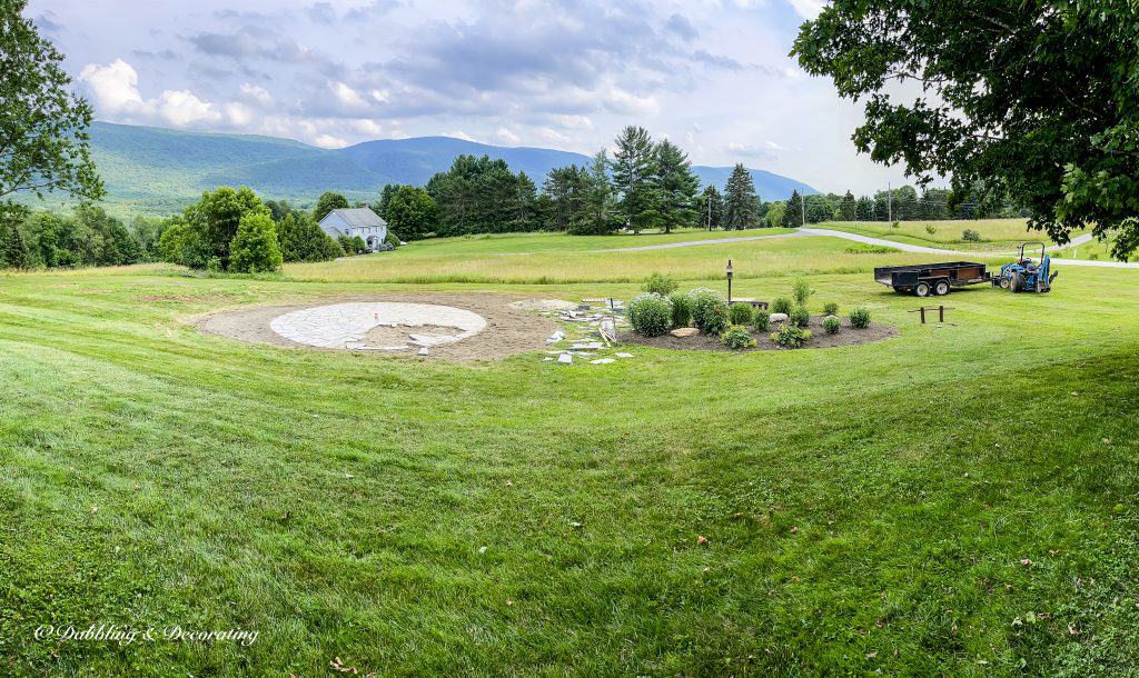 Outdoor Living space in the mountains with rounded fire pit design almost finished.