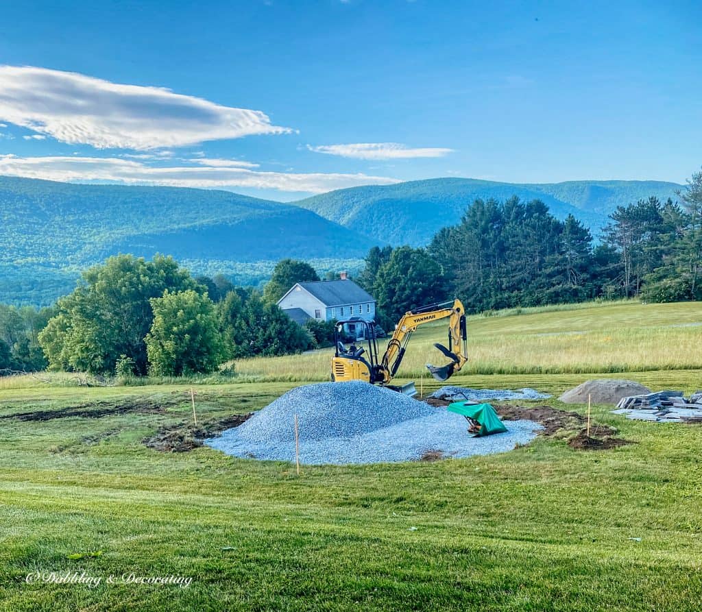 Outdoor living patio space in the mountains with pea stone.