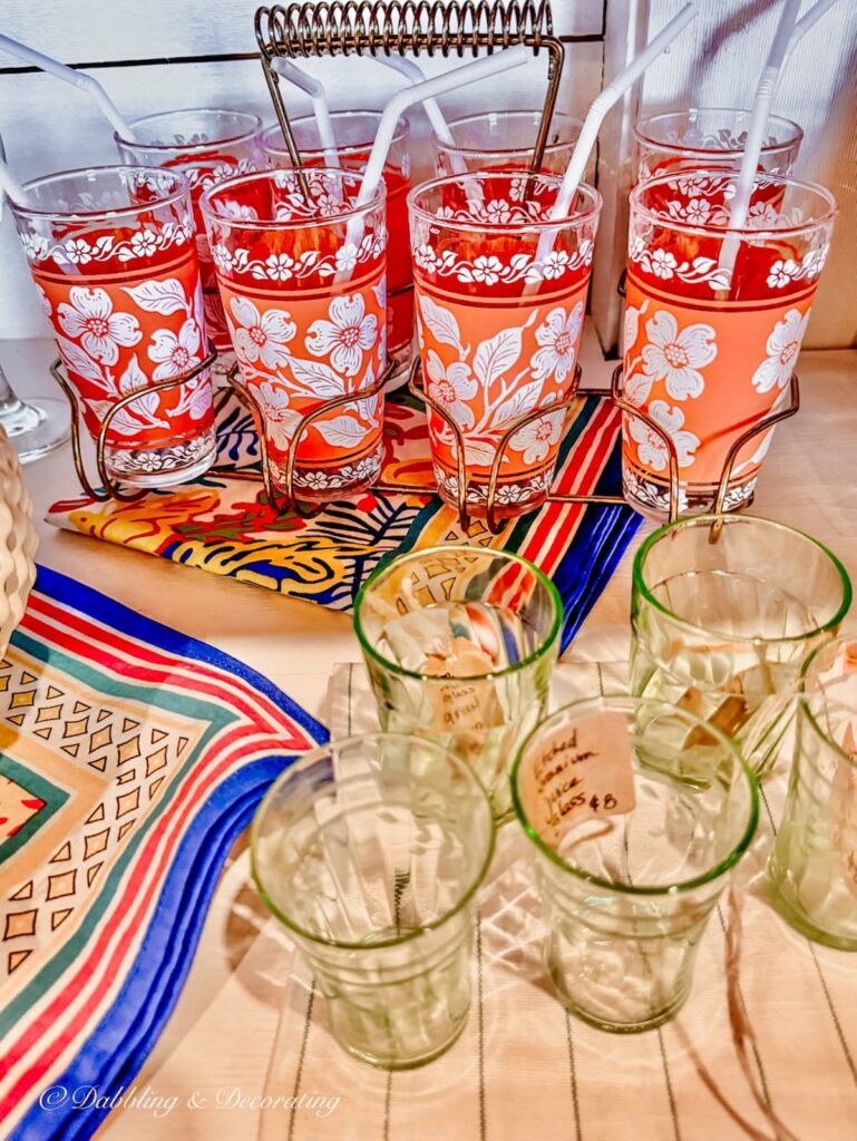 Vintage Jeannette glassware in orange at vintage store.