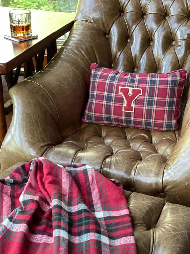 Leather chair with varsity letter pillow