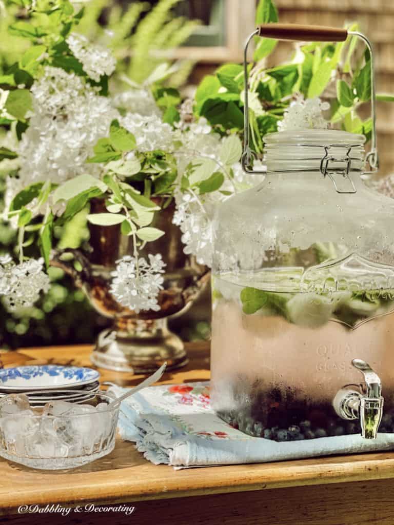 Flavored water jug with a bowl of ice.