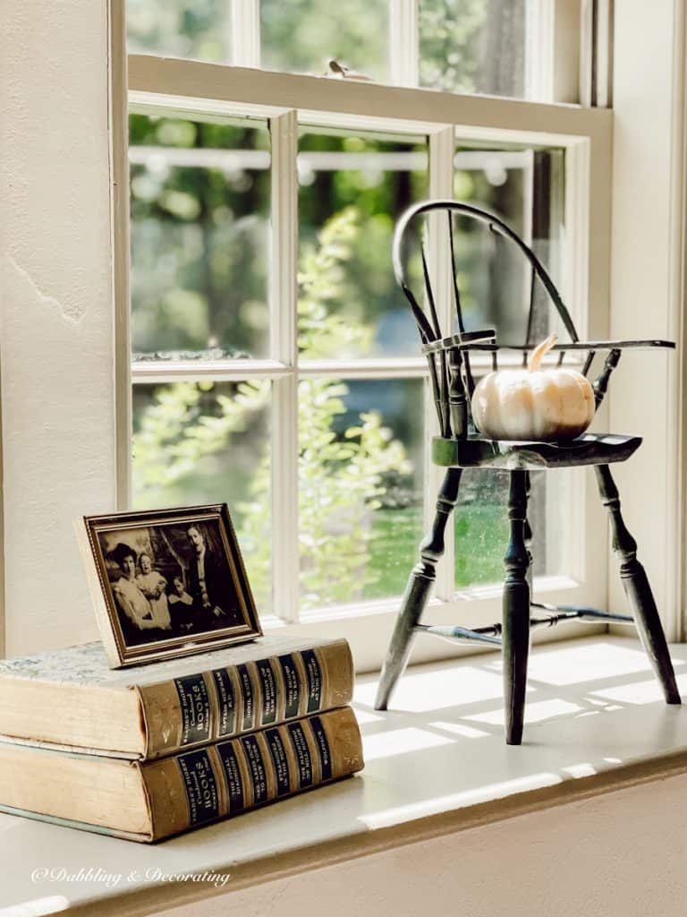 Doll Chair with Pumpkin and  books and photo.