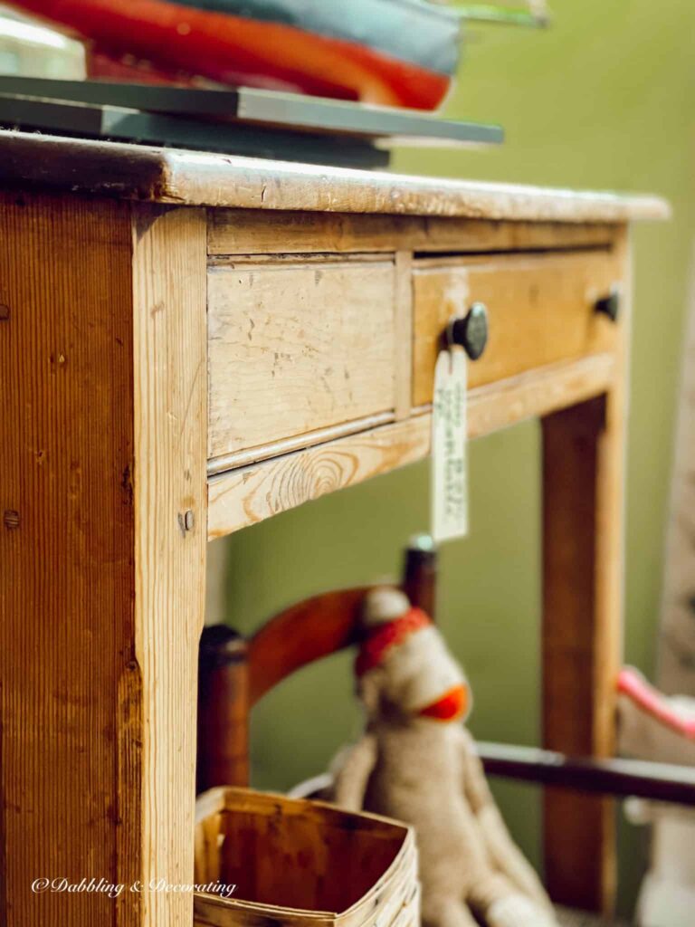 Close up picture of an antique desk at antique store.