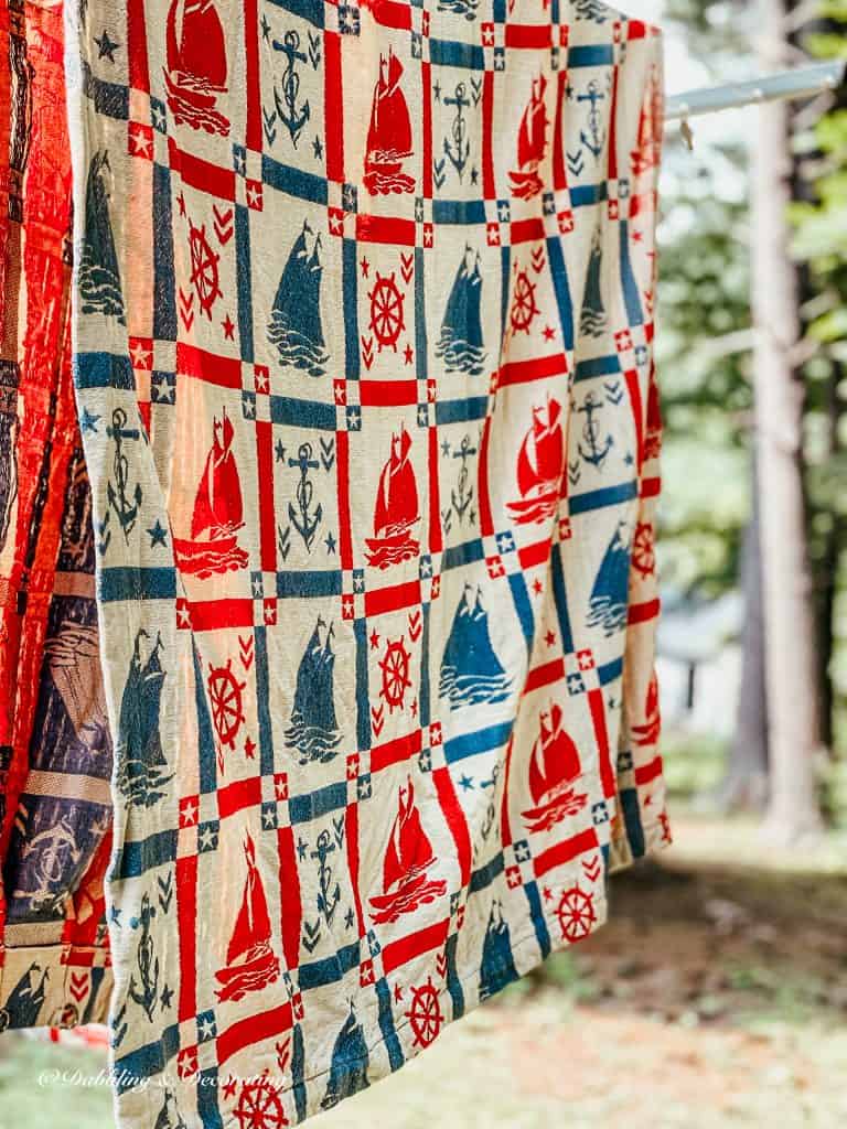 Coastal Curtains with Nautical style on clothesline.