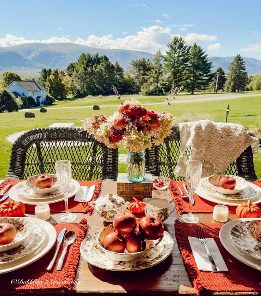Fall Tablescape with Johnson Brothers Autumn's Delight dishes in the mountains on home porch for fall.