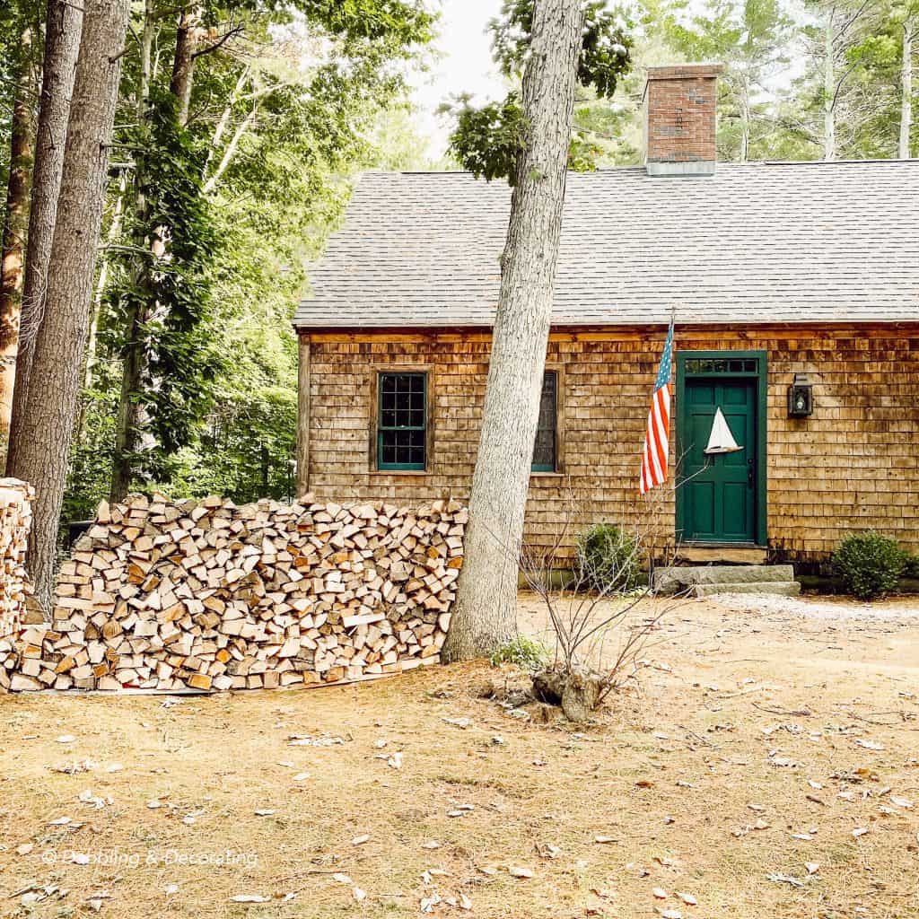 Coastal Maine Home with firewood before  the fall colours arrive.