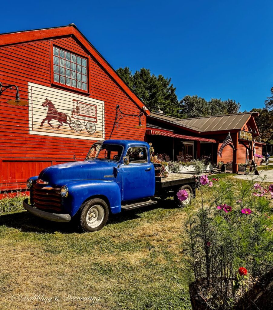 Antique blue pick up truck decorated for fall in front of the Vermont Country Store in Weston, Vermont.