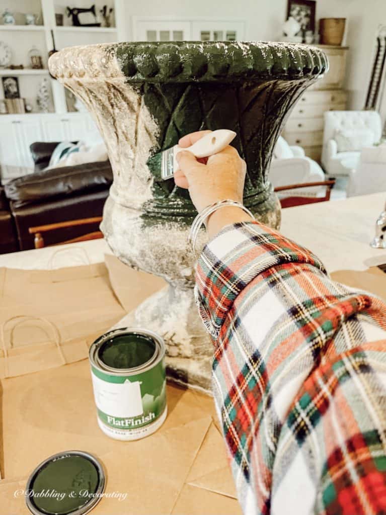 Painting a plastic urn in Vermont fall colours, green.