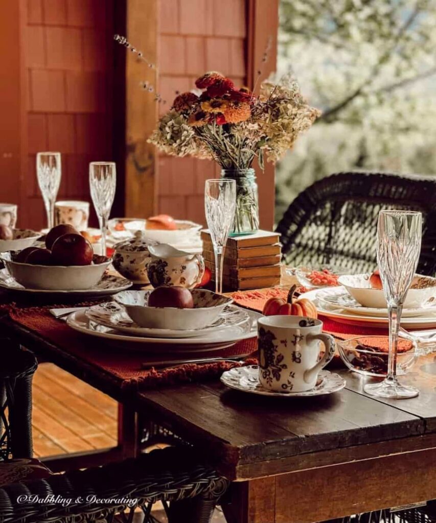 Autumn themed dinnerware with Johnson Brothers Autumn's Delight on outdoor porch.