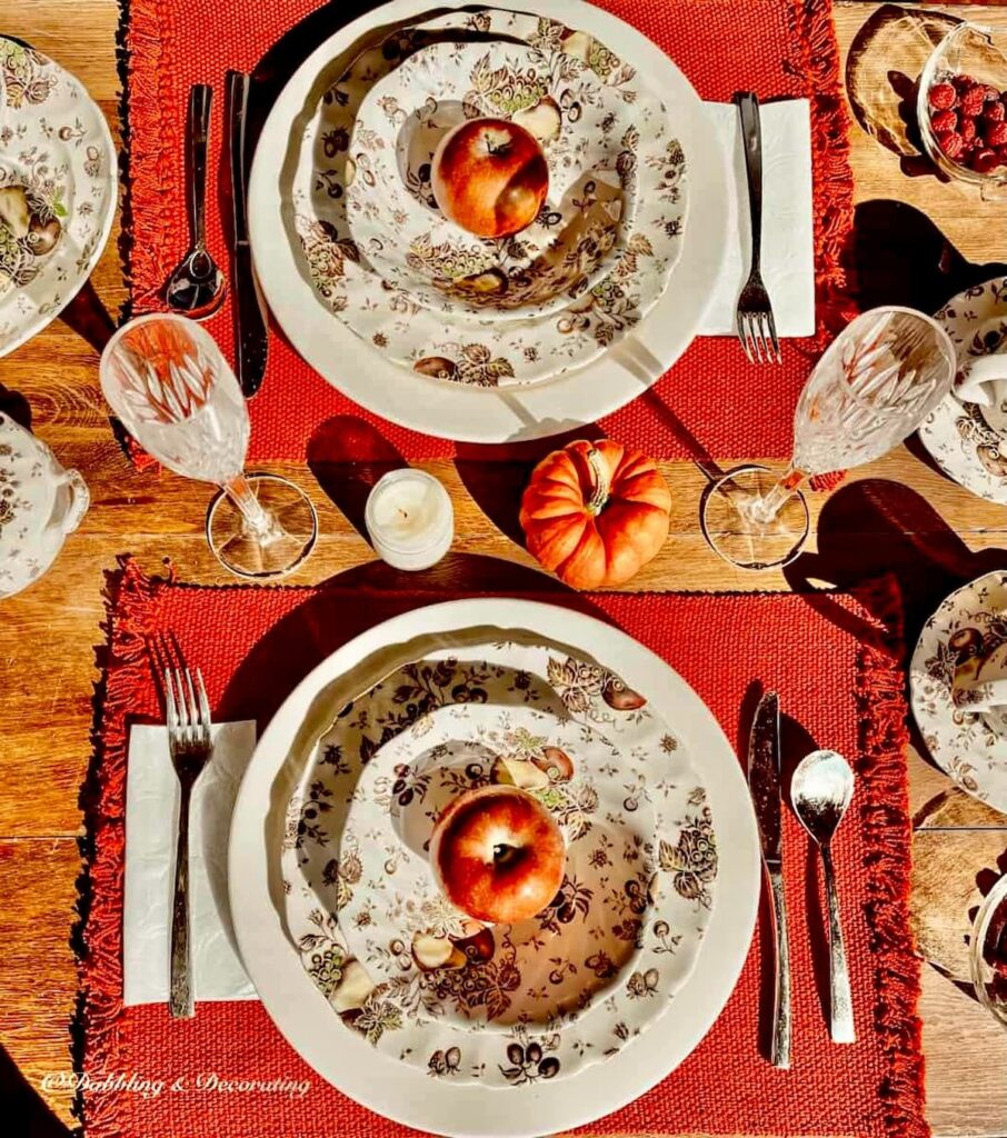 Top down view of autumn themed dinnerware with Johnson Brothers Autumn's Delight Place settings.