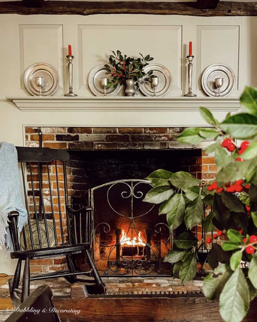 Early American Fireplace Mantel with antique pewter decor, Boston Rocker decorated for Christmas.