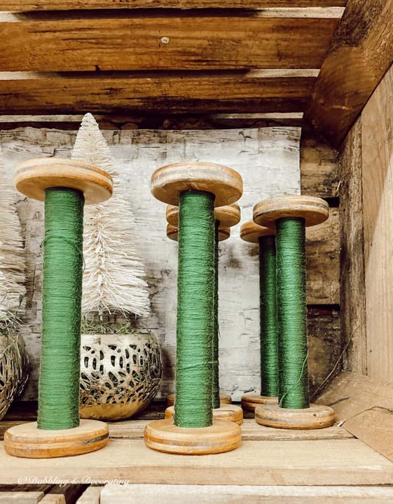 Vintage spools with green threads.