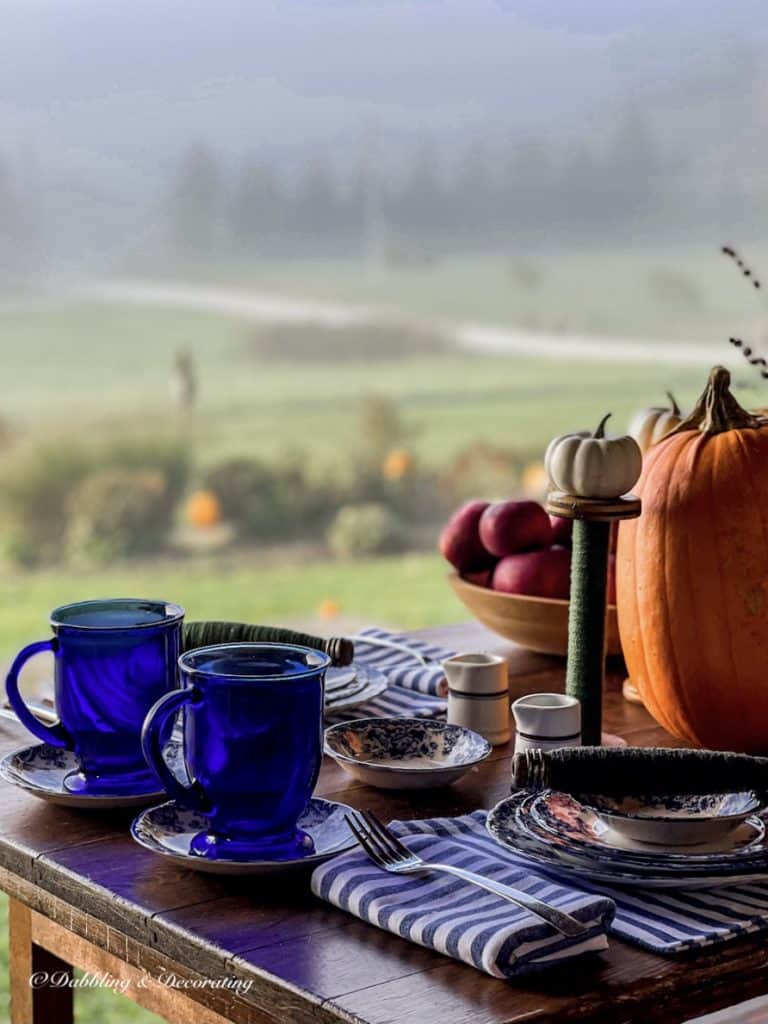 blue mugs on table foggy morning.