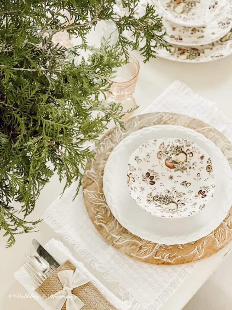 Setting a Winter Table with wooden charger dishes.