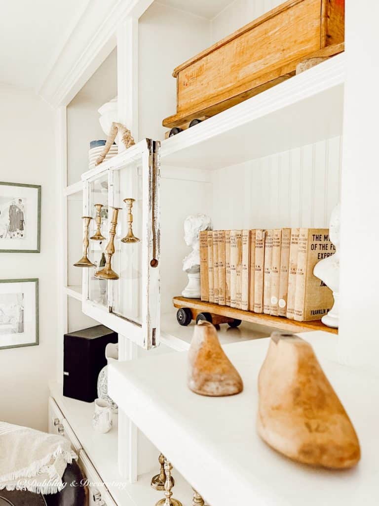 Salvaged Windows and Brass Candlesticks, bookshelves and mantel.