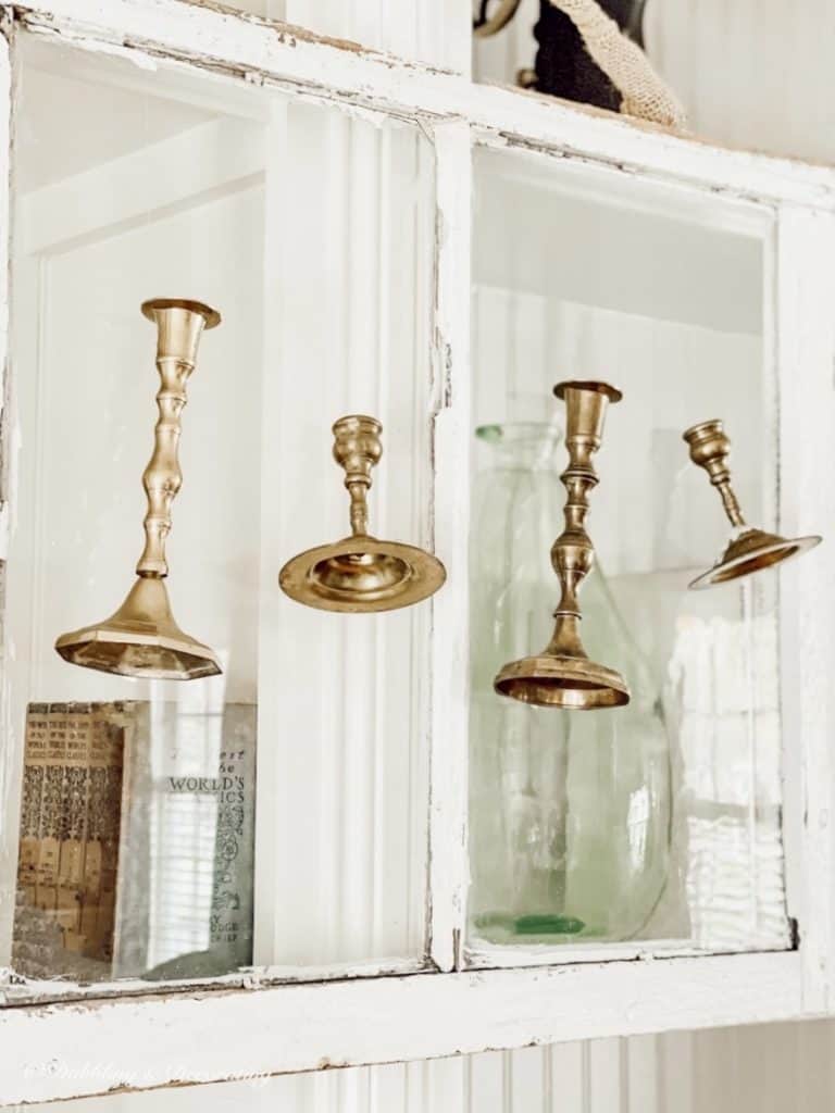 Salvaged Windows and Brass Candlesticks hanging