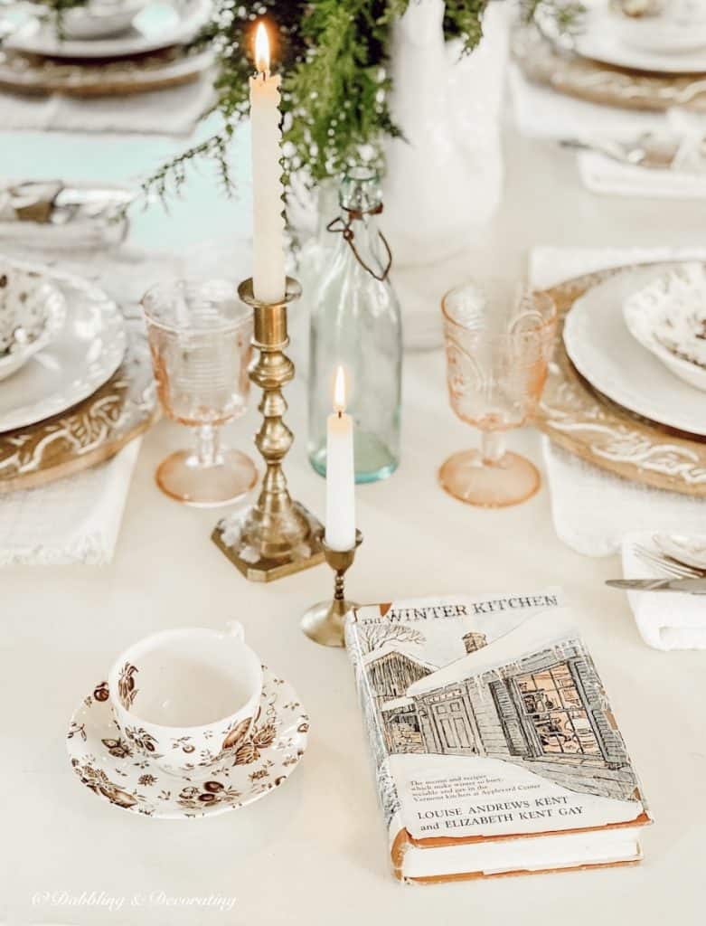 Setting a Winter Table with an old book and candles.