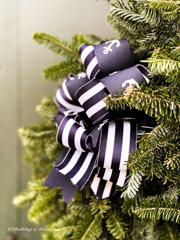 Christmas Front Door Tradition 2021 with navy blue bows