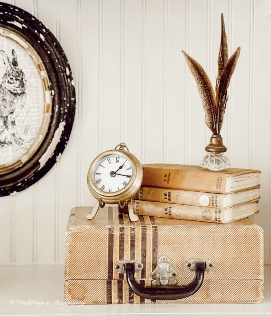 Suitcase, Books, and clock on neutral built-ins