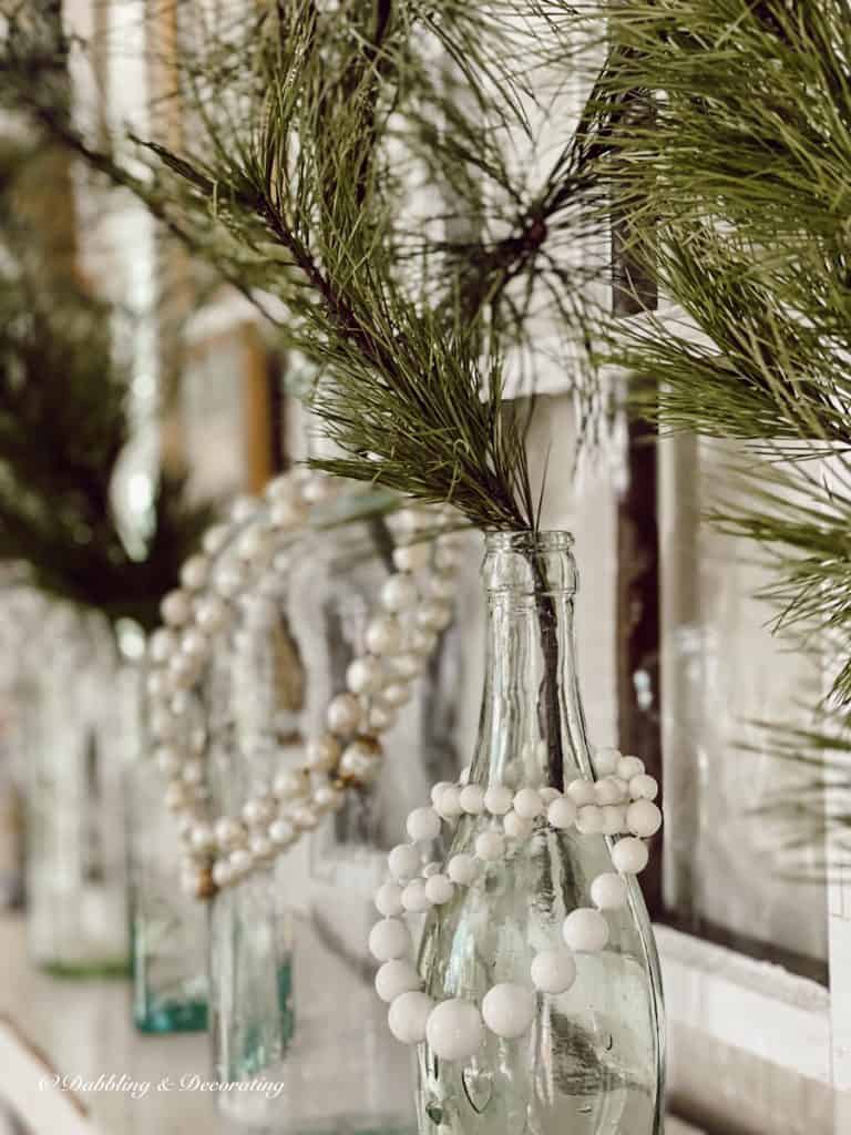 Vintage Blue Bottle with Greenery and pearl necklades