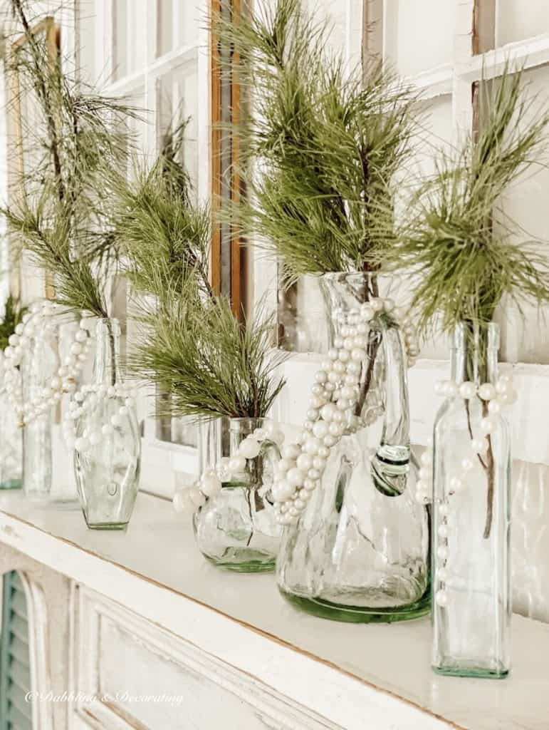 Vintage Bottles on white farmhouse dining room mantel