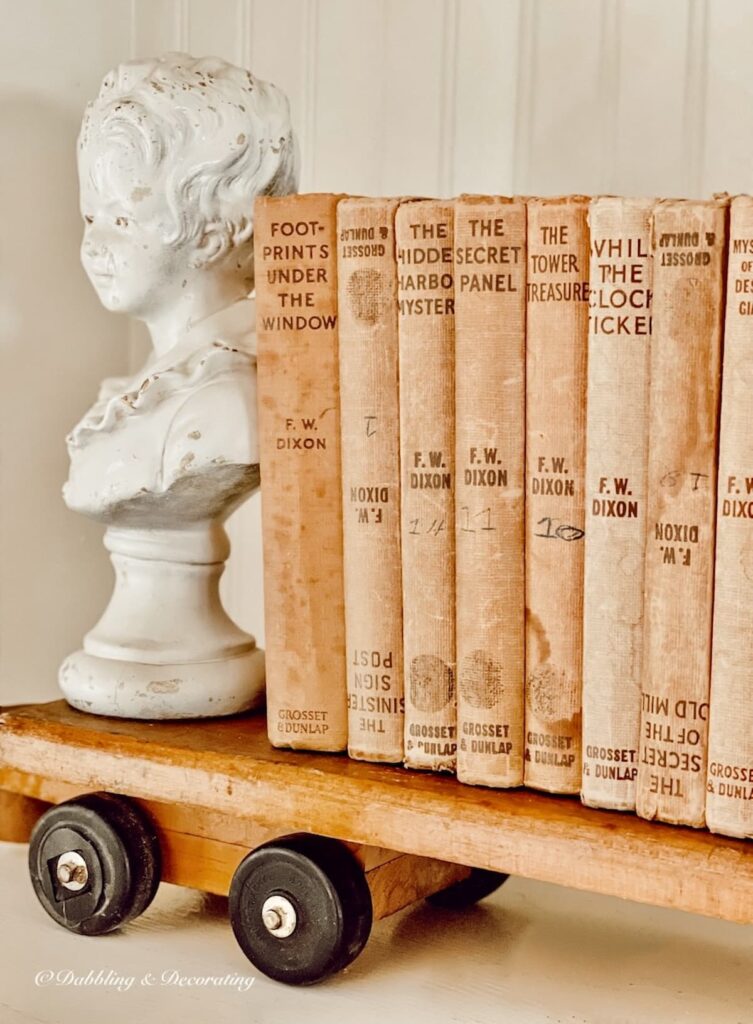 Vintage Hardy Boy Books with Vintage Bust on Built ins.