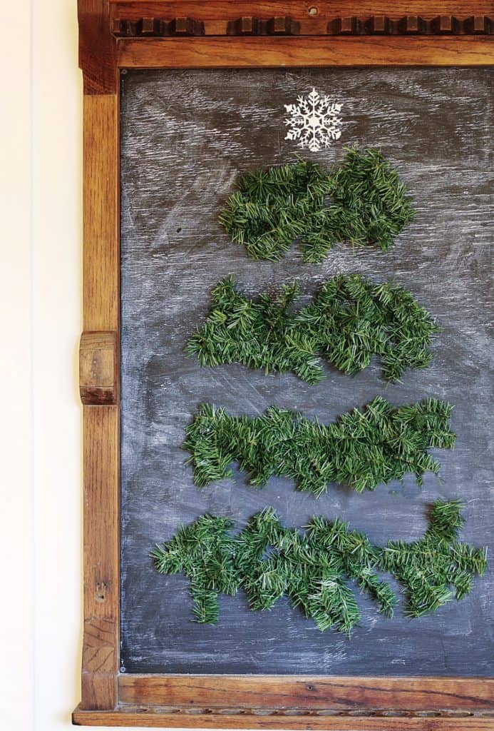 SIMPLE FIVE-MINUTE CHRISTMAS DOLLAR STORE DIY, chalkboard with evergreens.