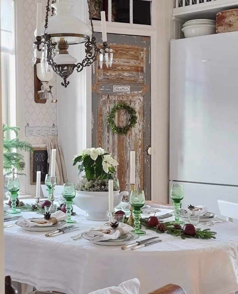 Christmas table setting with white and green glasses.  Stunningly gorgeous in homes in Sweden.
