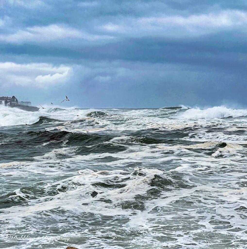 Surf's up in York Maine on a drive to the ocean during a cozy snow day in Maine.