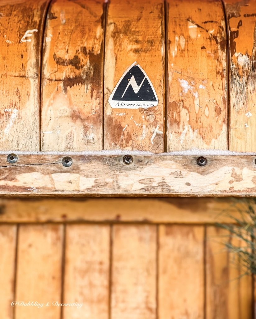 Vintage wooden sled with Northland Logo close up.