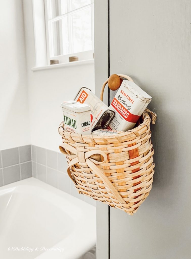 Basket of vintage band-aid tins.