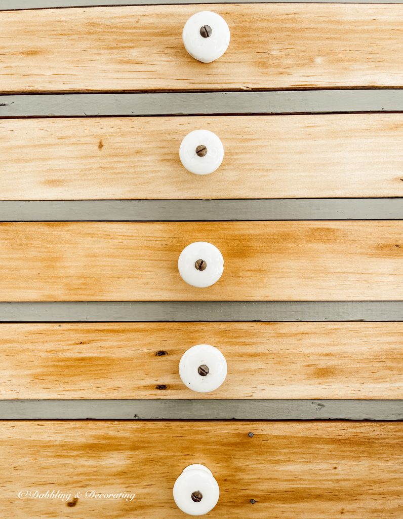 Vintage white knobs on vintage hutch drawers.