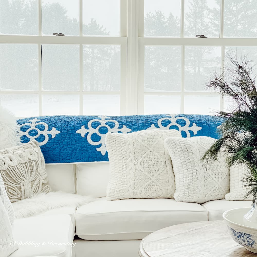 Blue and White Quilt in sunroom