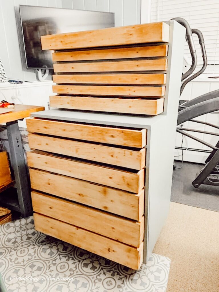 Vintage hutch during restoration process in antique store.